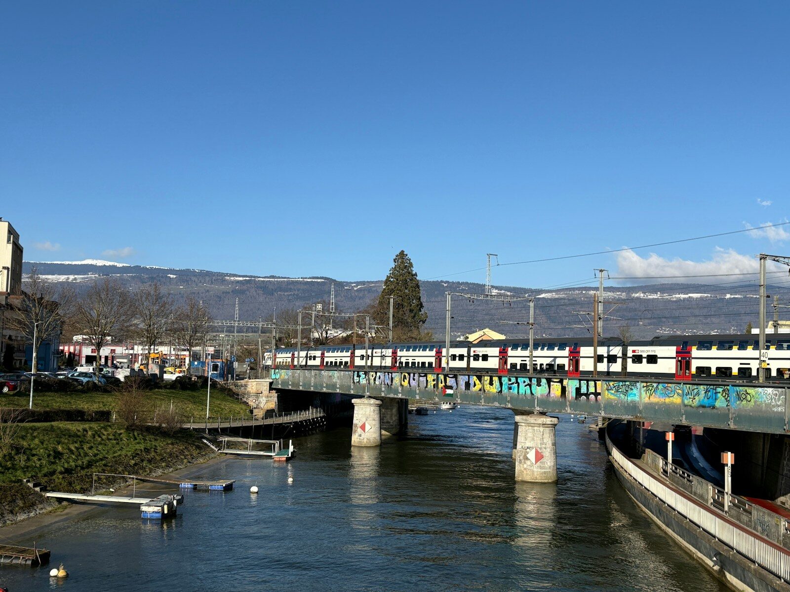 A train traveling over a bridge over a river